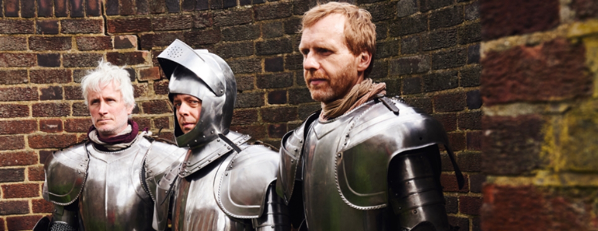 Photo of the members of the Clientele wearing armour
